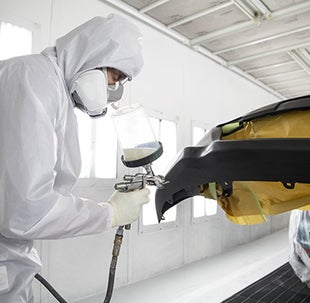 Collision Center Technician Painting a Vehicle | Keyes Toyota in Van Nuys CA