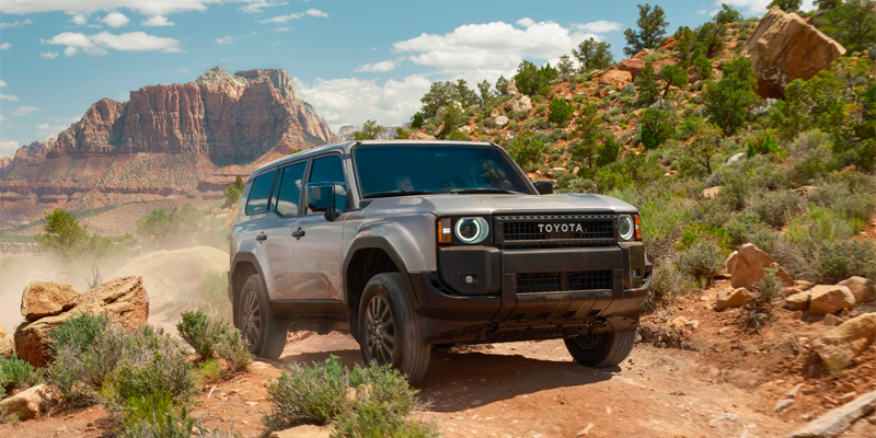Toyota Land Cruiser driving off-road in a desert landscape near Van Nuys, CA