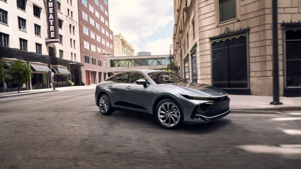 A Toyota Silver Certified vehicle driving in the city