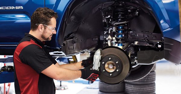 Technician performing Toyota brake repair