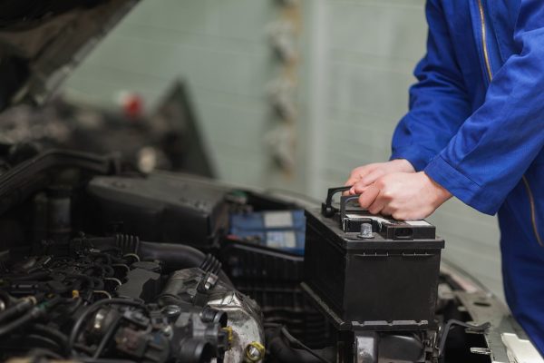 Technician performing a Toyota battery replacement