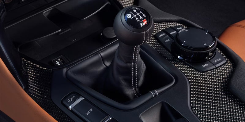 Interior view of a 2025 Toyota GR Supra with a manual gear shifter and tan leather seats