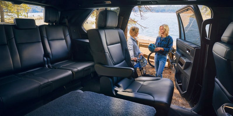 Spacious third-row seating in the 2025 Toyota Sequoia with two passengers enjoying the rear