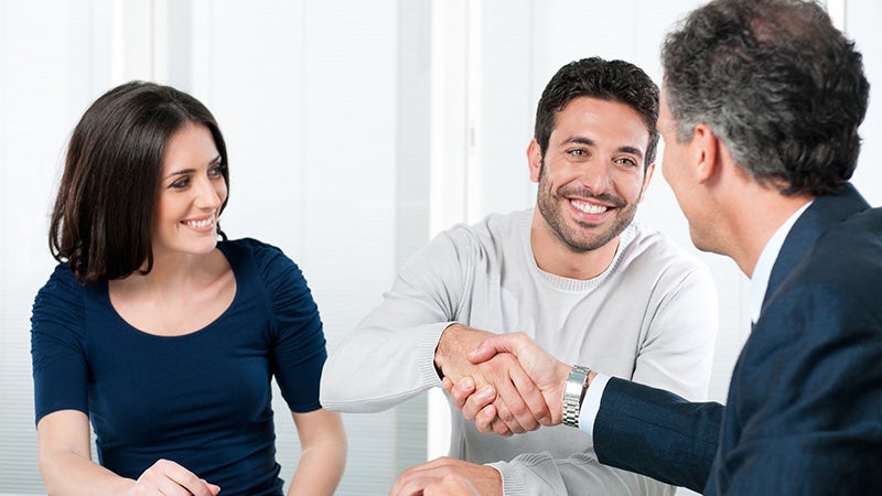 couple shaking hands with salesman Keyes Toyota in Van Nuys CA